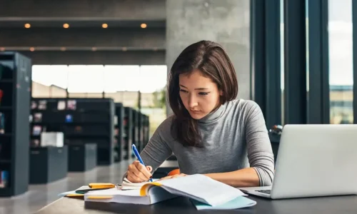 Female student taking notes